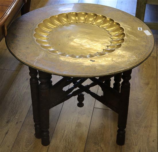An Indian brass tray top table